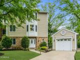Rare, spacious end-unit with water views and detached garage